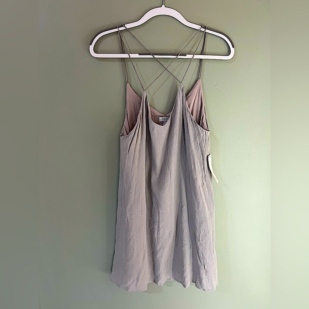 TOBI new with tags mini grey in color crinkle material size medium cross cross
